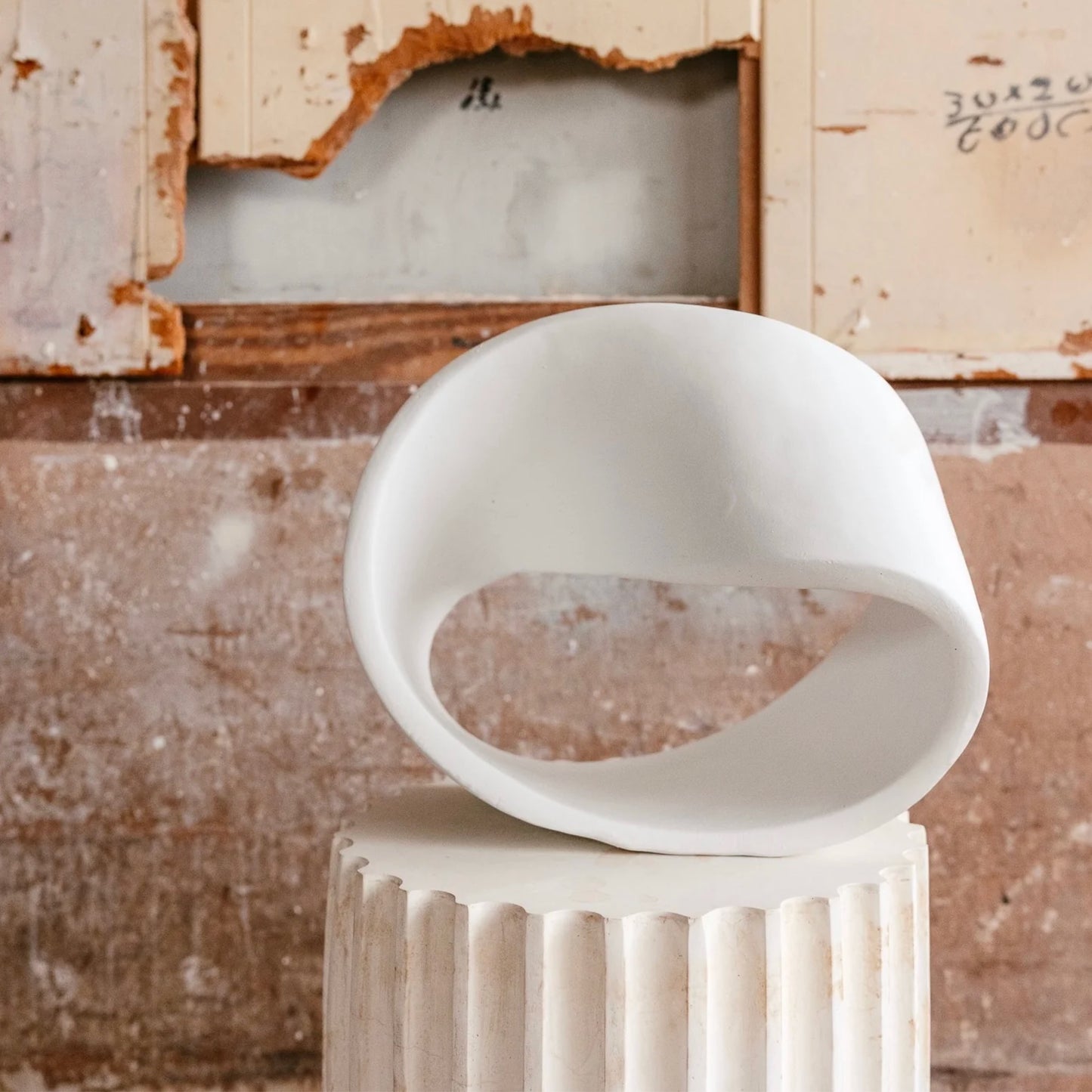 Modern Mobius strip statue white mathematical abstract sculpture