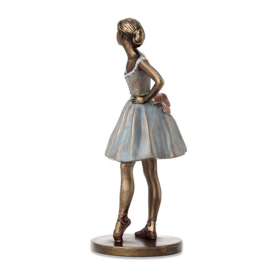 Side view of Degas rose ballerina dancer statue showing facial expression of poise, upper body musculature, and hand positioning demonstrating sculptural craftsmanship.
