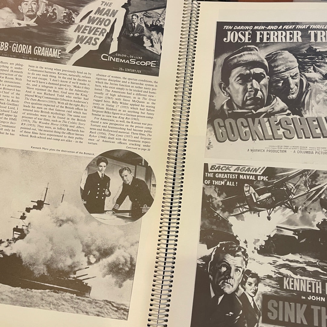 Vintage movie posters and newspaper clippings on a spiral-bound book.