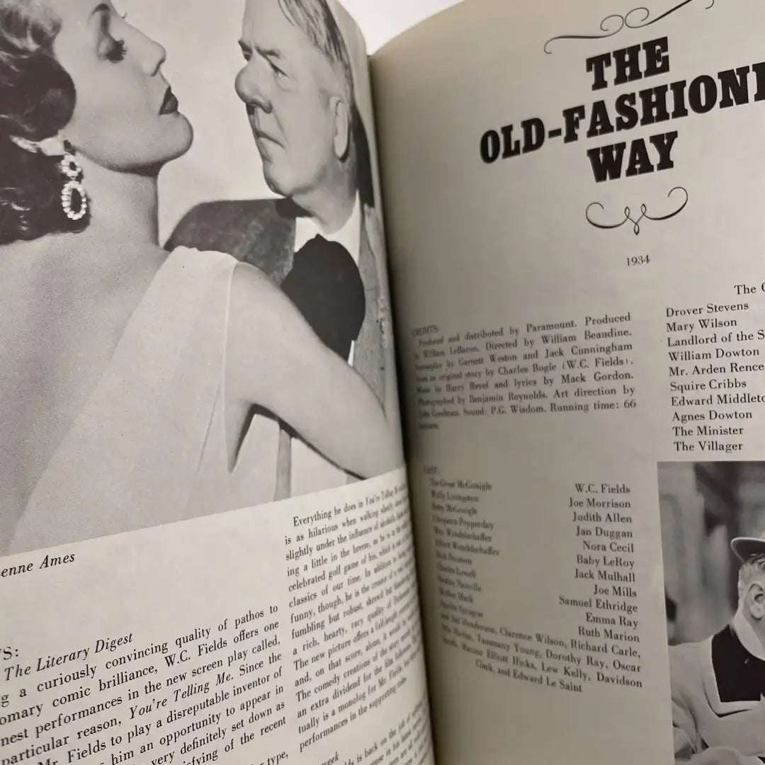 Open book with vintage-style text and images, featuring a couple and movie-related content.
