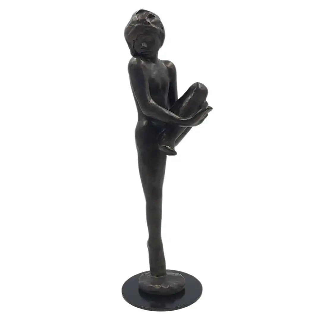 Side angle of Rodin Mouvements de Danse sculpture showing lifted leg and balance.