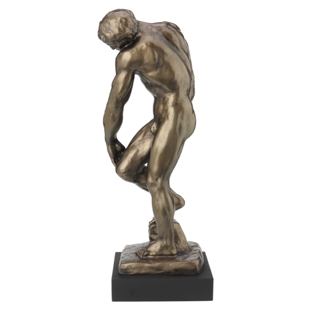 Side angle of Adam from Gates of Hell statue highlighting musculature