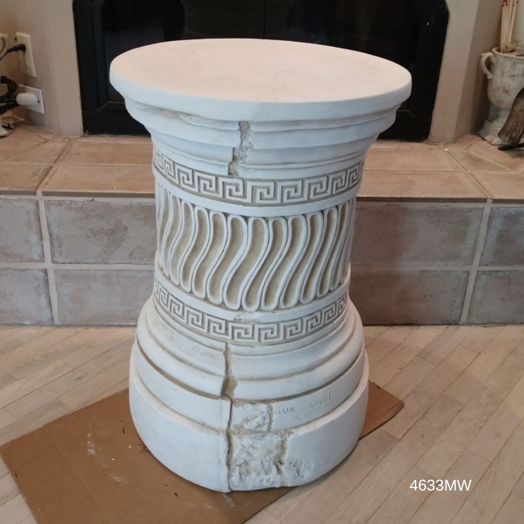 Shows Greek Key pattern on round dining table base for glass top