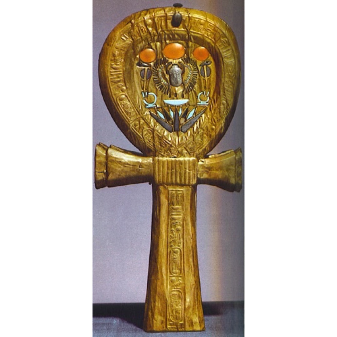 Original Egyptian Ankh symbol wall hanging made of gold-toned metal with hieroglyphic engravings and orange circular accents
