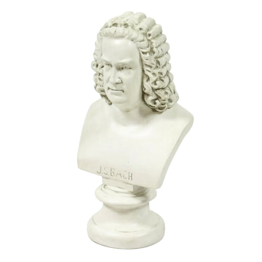A white plaster bust sculpture of J.S. Bach with curly hair, mounted on a round pedestal base.