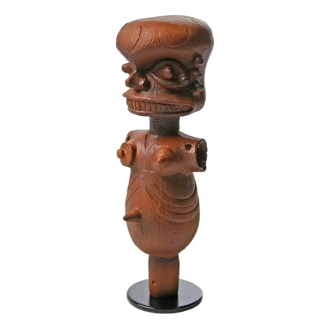 Three-quarter view of Ibibio puppet statue AFR05 showing intense facial expression with prominent eyes and teeth, Nigerian replica figurine