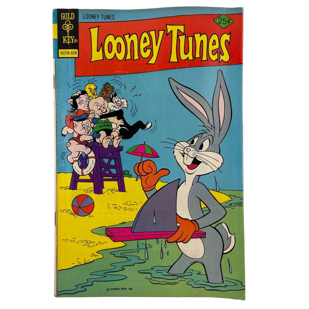 Looney Tunes comic book cover with Bugs Bunny and other characters on a beach.