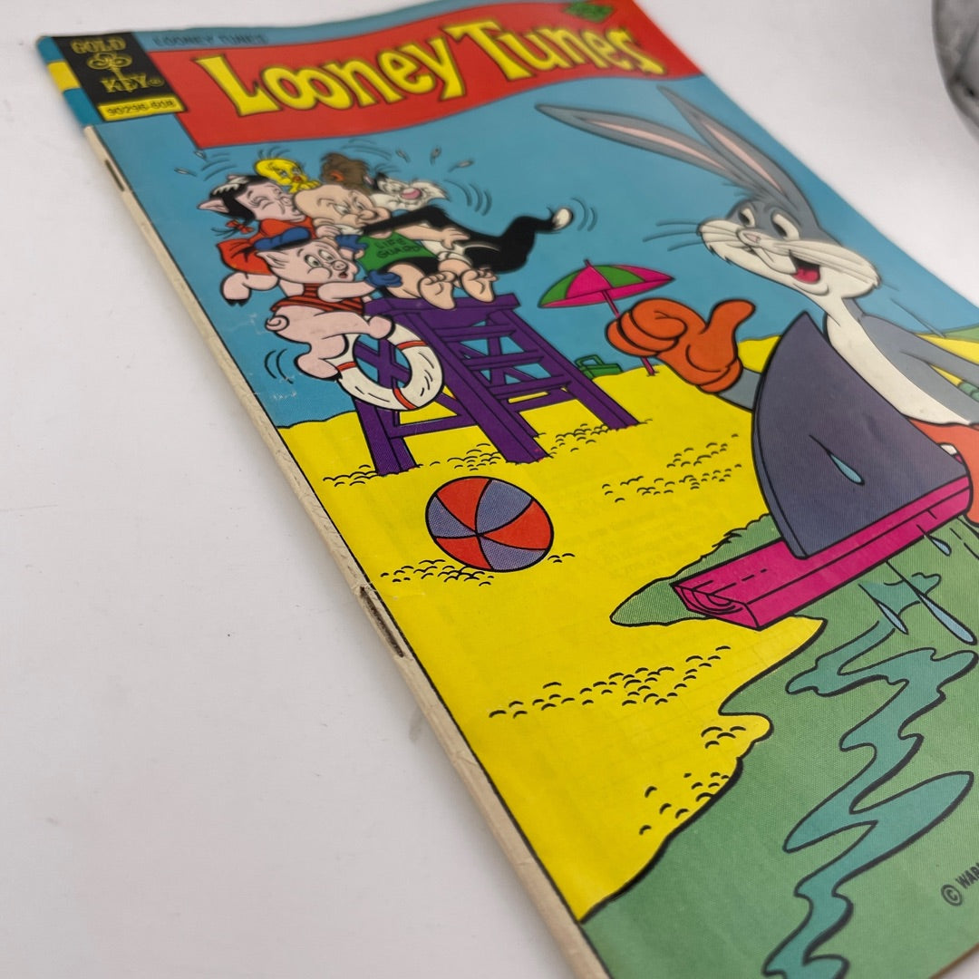 Looney Tunes comic book cover with cartoon characters on a beach