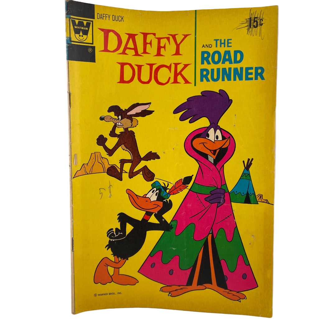 Vintage comic book cover featuring Daffy Duck and the Road Runner on a yellow background.