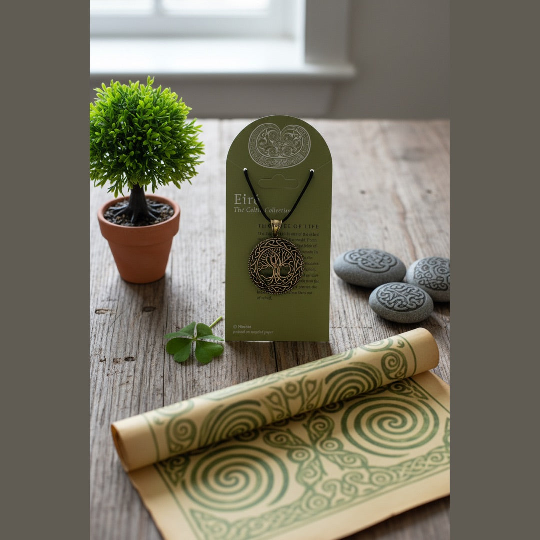A Celtic-style tree of life pendant necklace in silver-tone metal, hanging from a black cord on an olive green display card labeled 'Exré The Celtic Collection' by Nirvana.