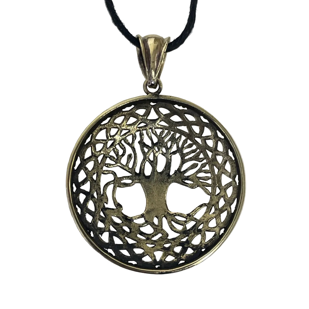 A circular tree of life pendant necklace with a filigree cutout design, featuring a gold-toned metal frame and a black cord, shown on a plain light gray background.