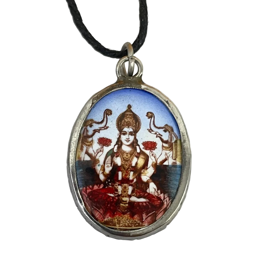 Close view of Lakshmi seated on a lotus, painted color ceramic insert