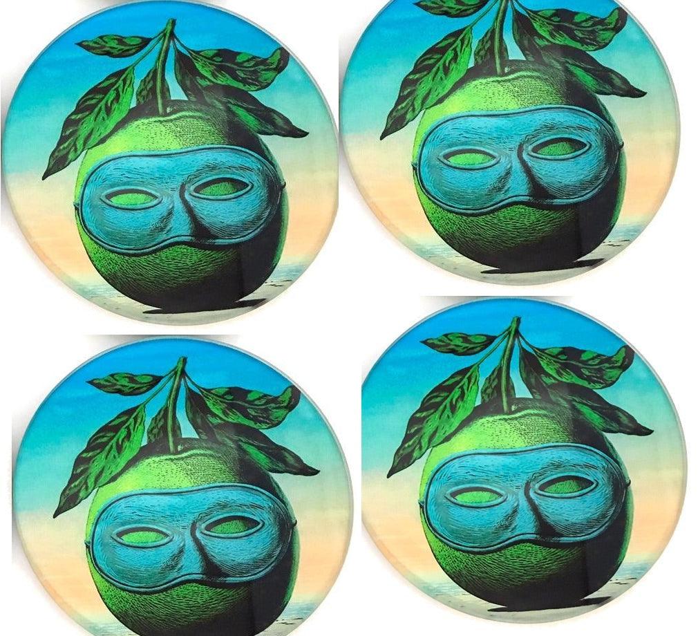 Four apple green coasters with surreal masked apple face and leaves, on blue background