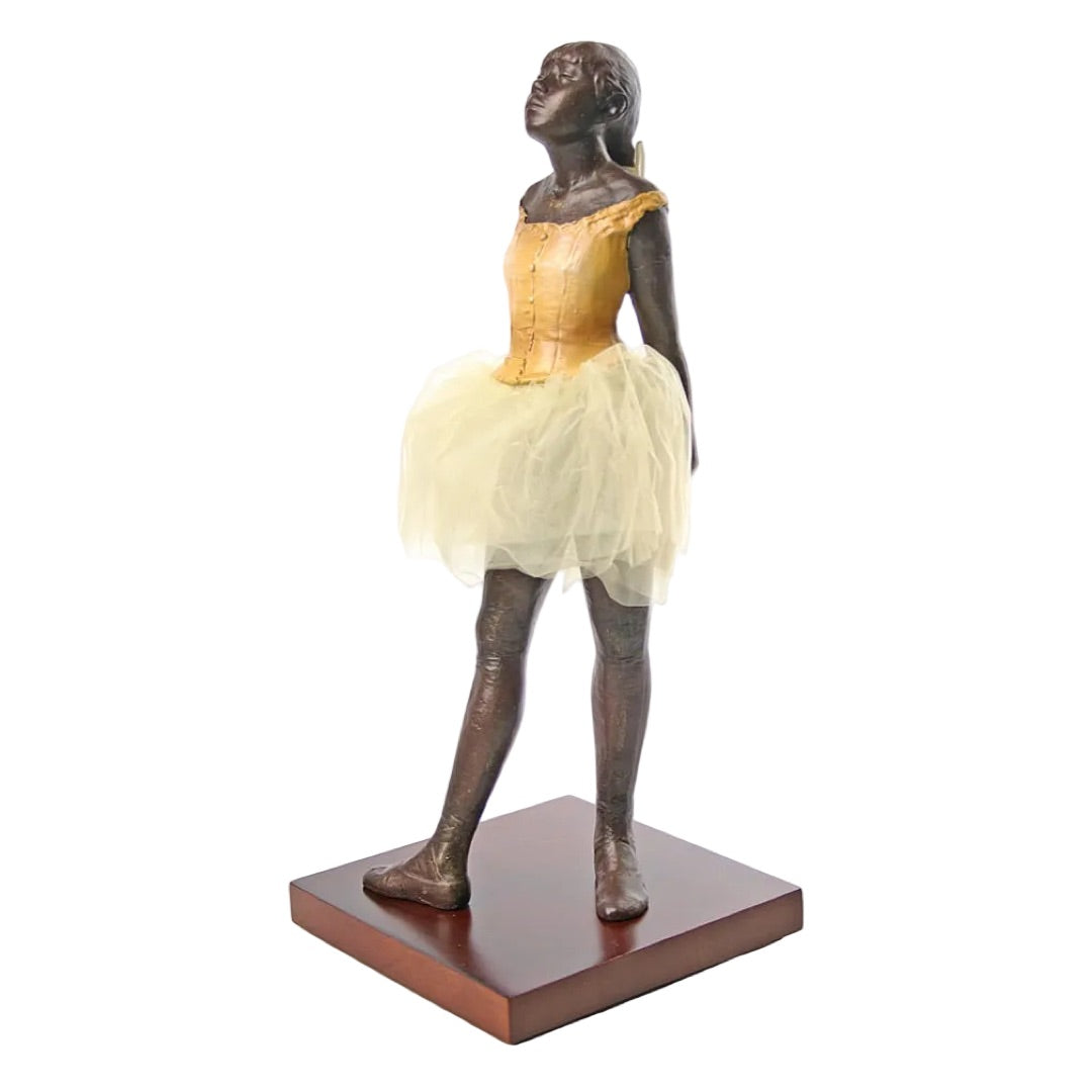 Degas Little Dancer of Fourteen Years statue with netting fabric skirt.