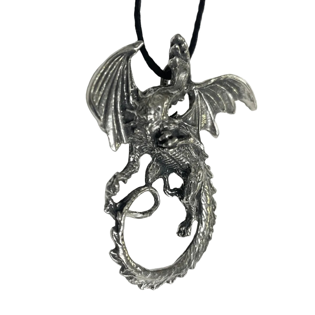 A detailed silver dragon pendant with spread wings, hanging from a black cord