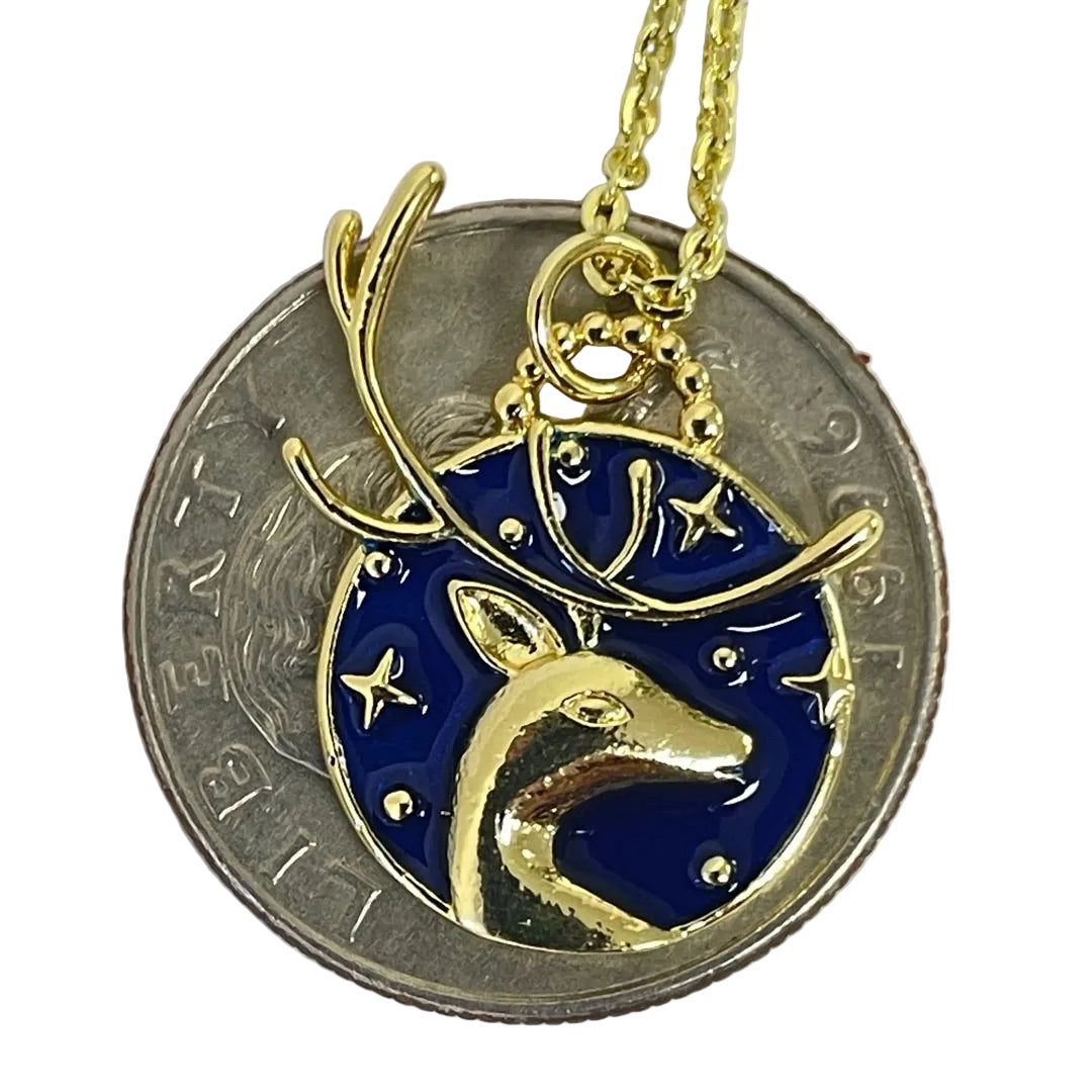 Artemis stag necklace displayed on quarter coin for scale