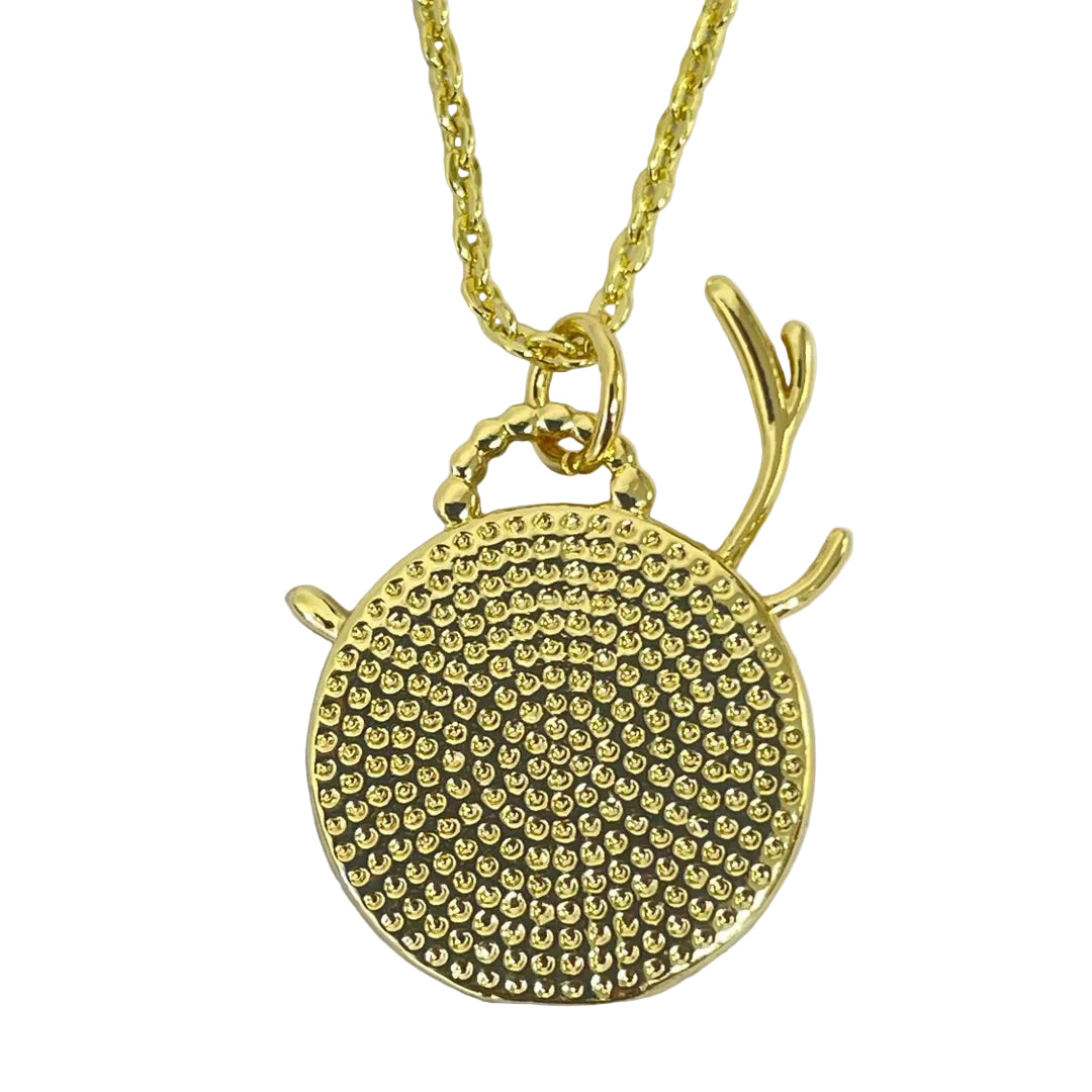 Back view of goddess Artemis pendant with stars, crescent, and deer imagery