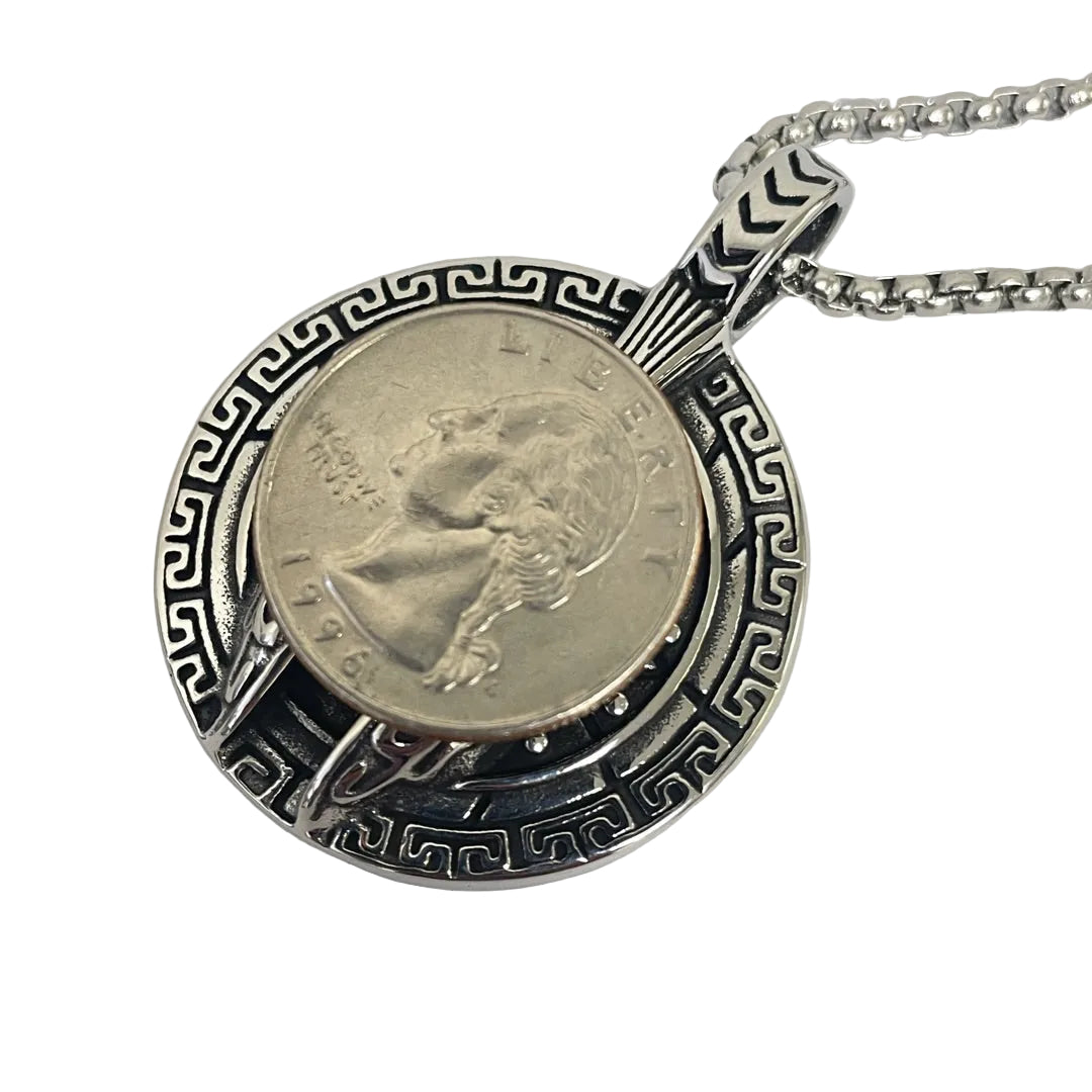 Front view of Spartan helmet centered in circular pendant with coin for scale