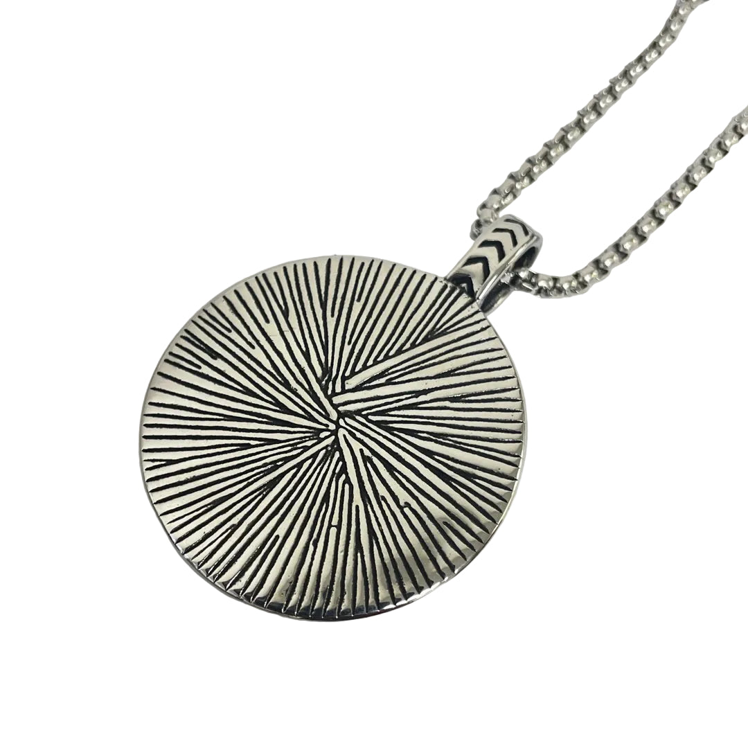 Back view of pendant showing radiating pattern and secure bail attachment
