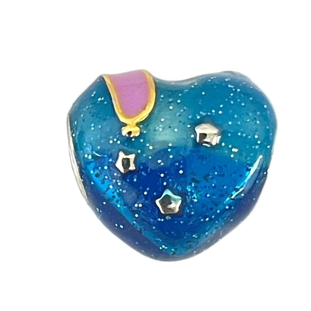 Back view of Melting Time Charm with sparkling blue background