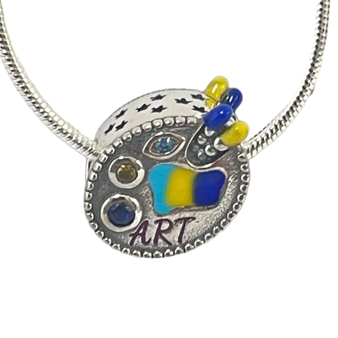 Front view of painter palette charm with colorful enamel and beaded border detail