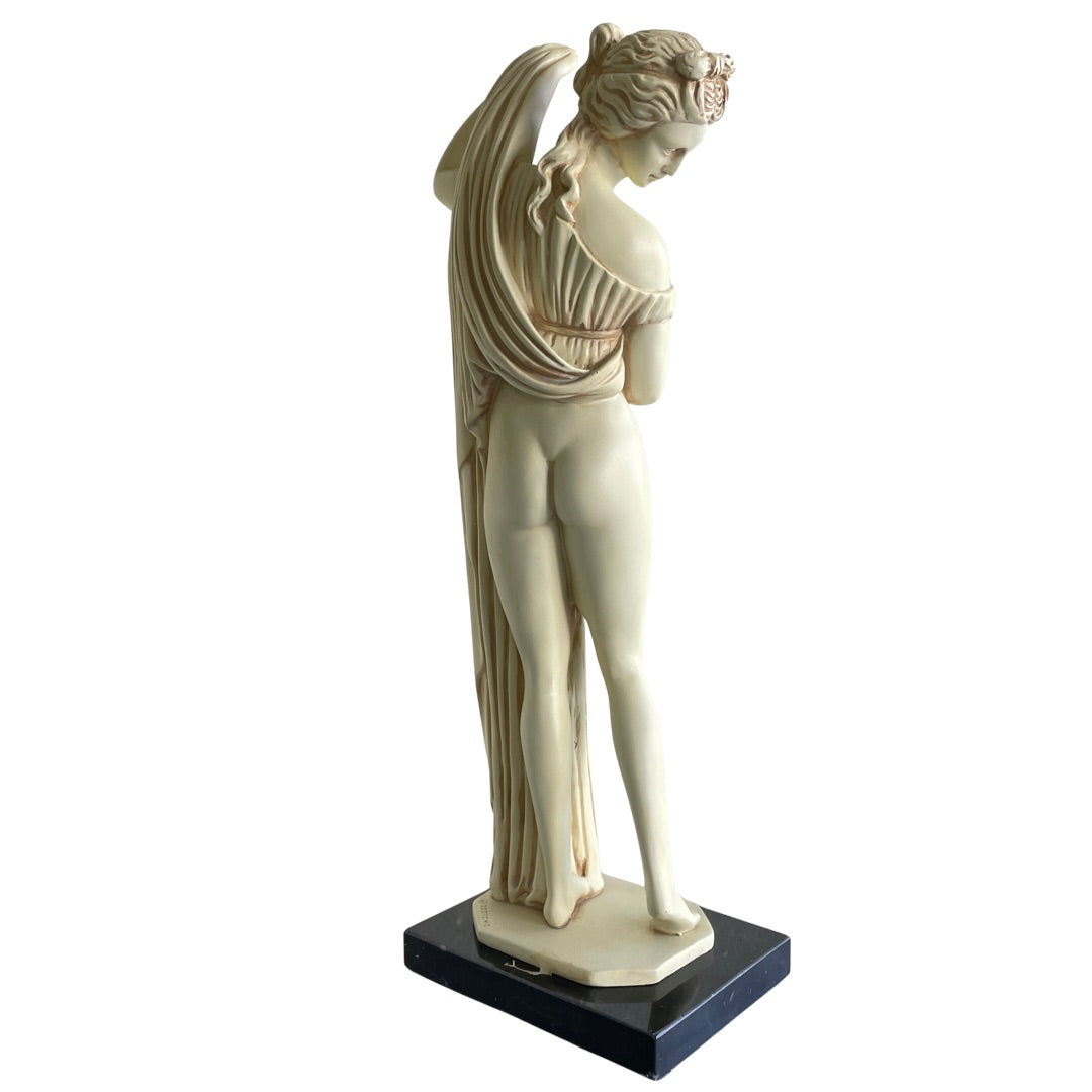 Back view of the Greek goddess statue and draped robe
