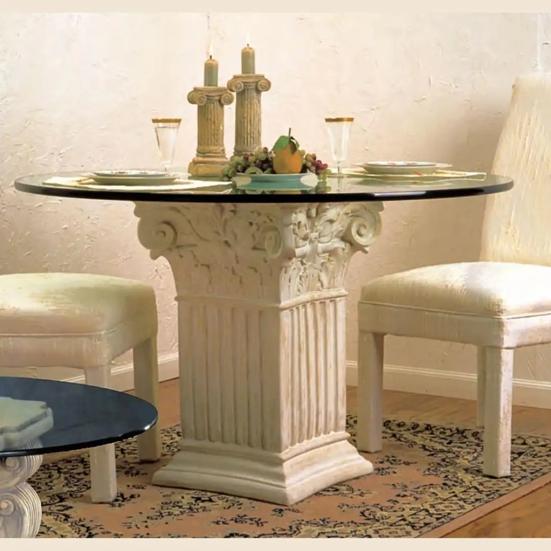 Single Corinthian table base with round glass top for small dining area