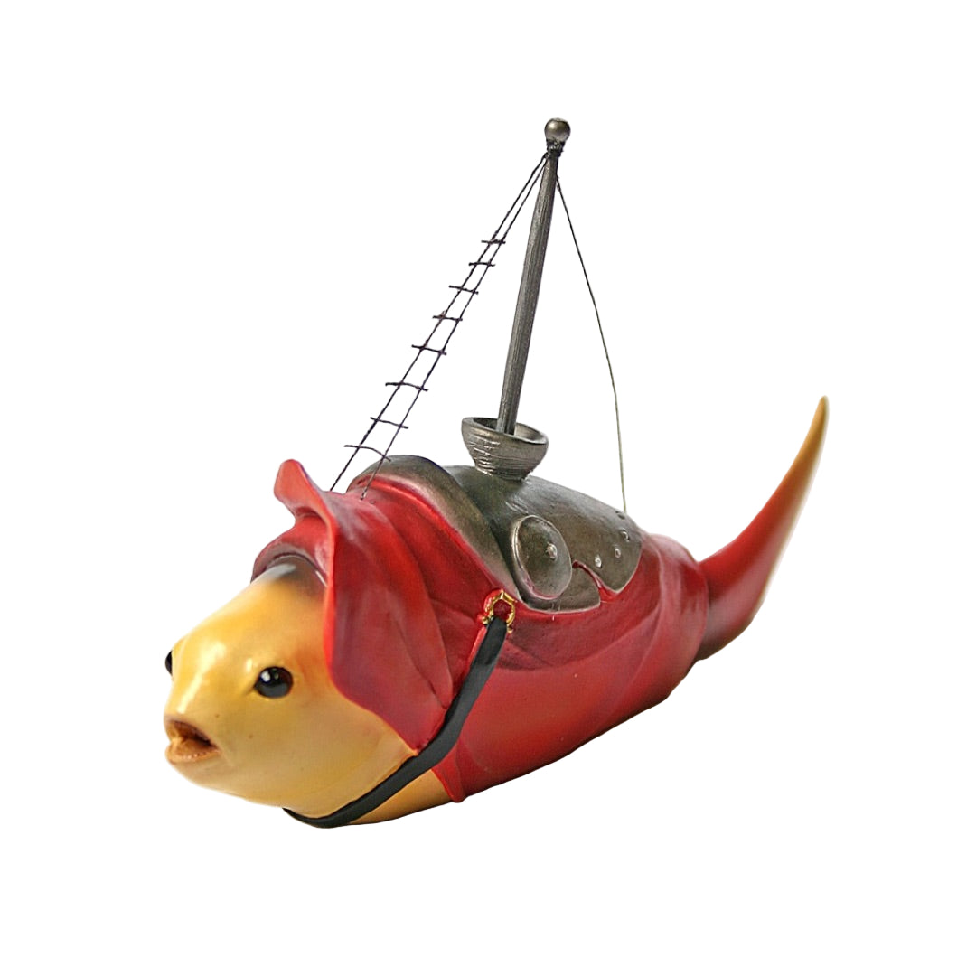 Side view of Bosch’s Fish With Mast statue showing gold tail and tiny rigging details.