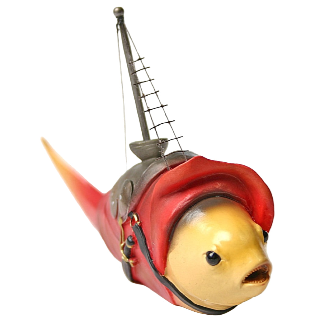 Armored fish figurine with bright red coat and mast, inspired by Bosch’s surreal fantasy.