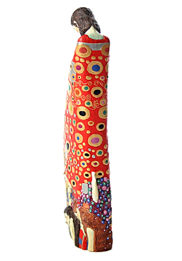 Klimt-inspired pregnant figure sculpture with colorful abstract patterns on white background.