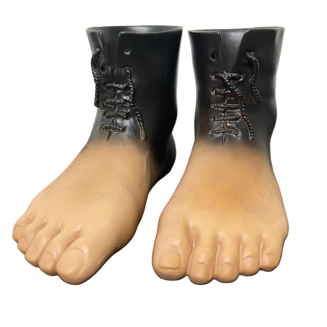 Small Magritte-inspired Red Model feet sculpture in surreal style.