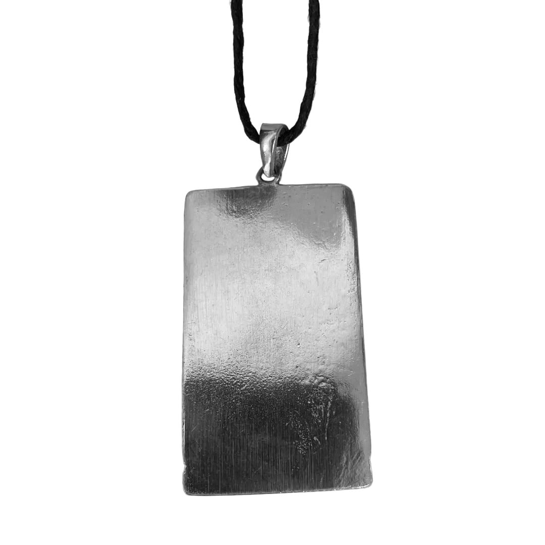 Back side of Maat pendant with her ostrich feather of truth in pewter relief