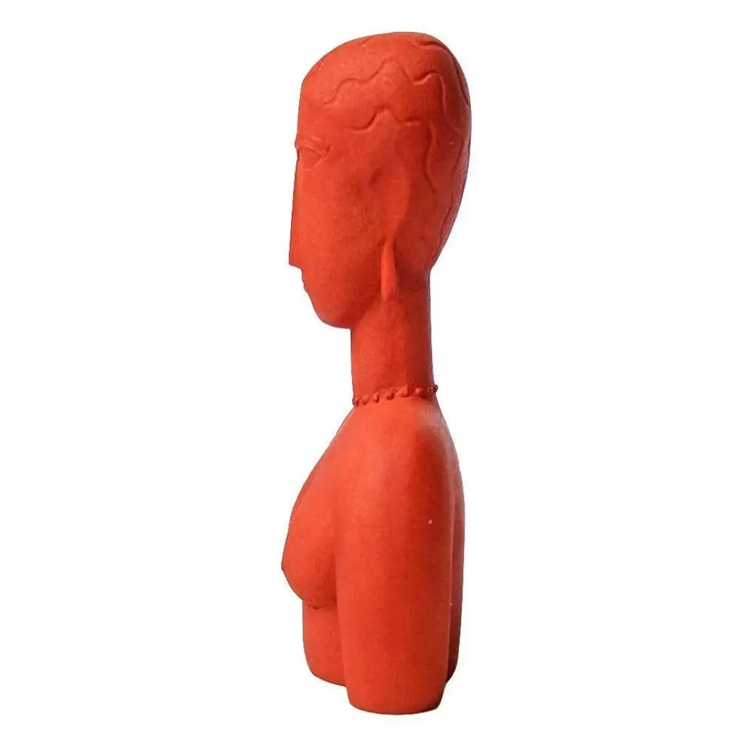 Side profile of Modigliani abstract female bust MO14 showing curved elongated torso and simplified facial features in red resin