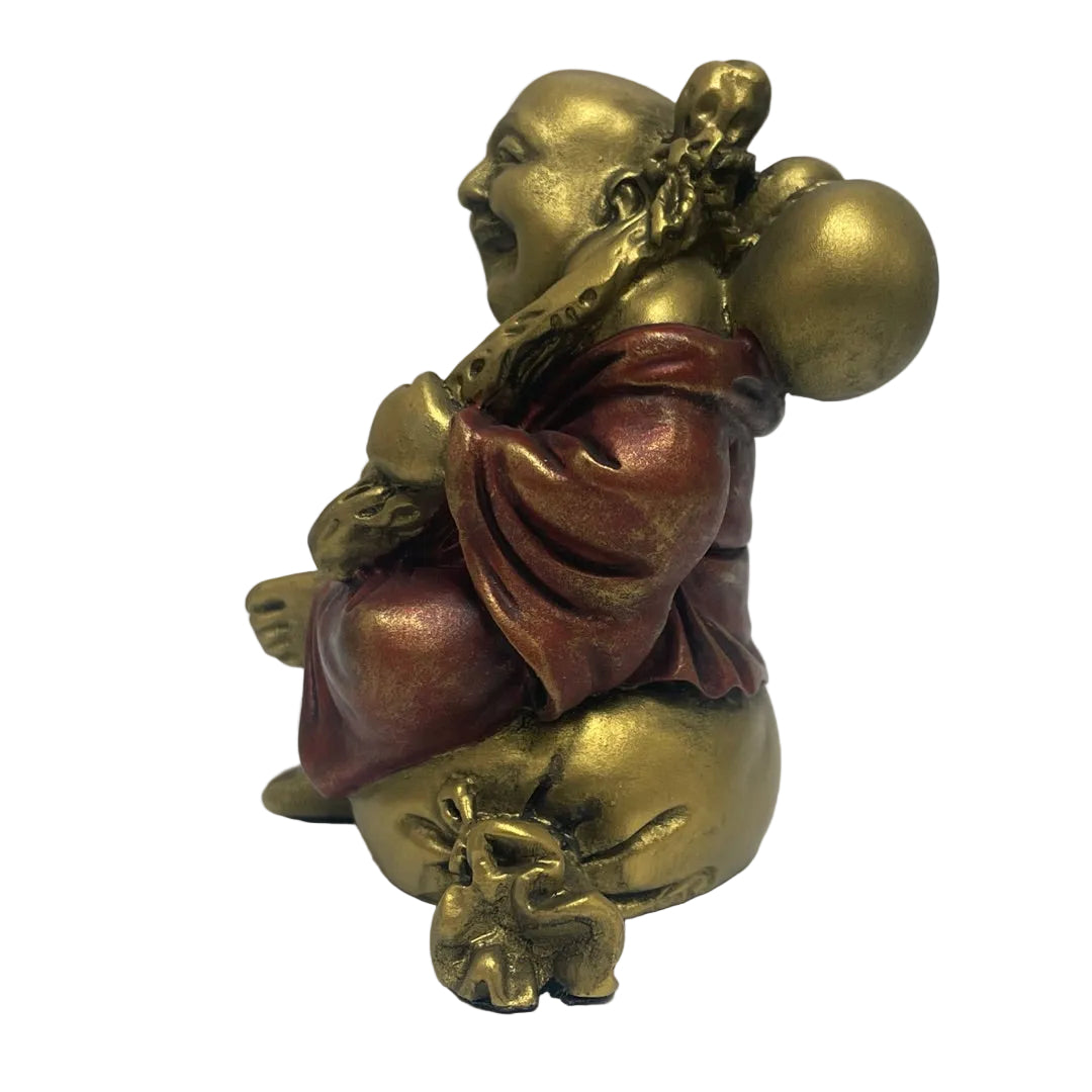 Side view of Laughing Buddha statue
