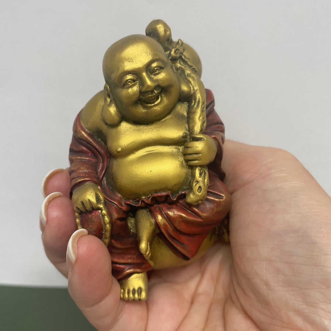 Hold Happy Buddha in your hand and smile