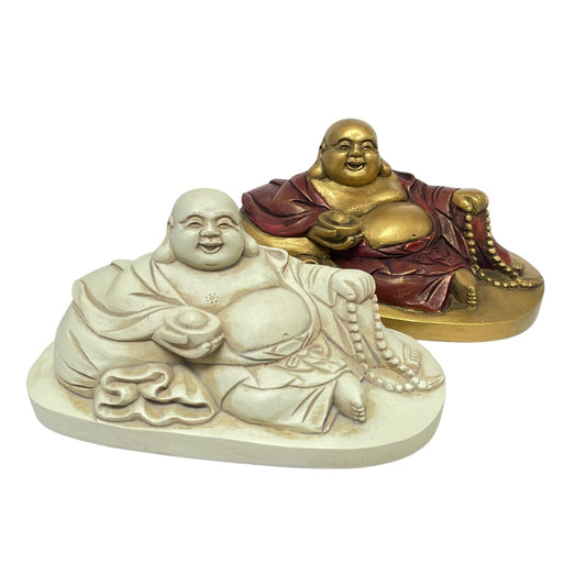 Antique white and gold and red reclining Budai statues side by side