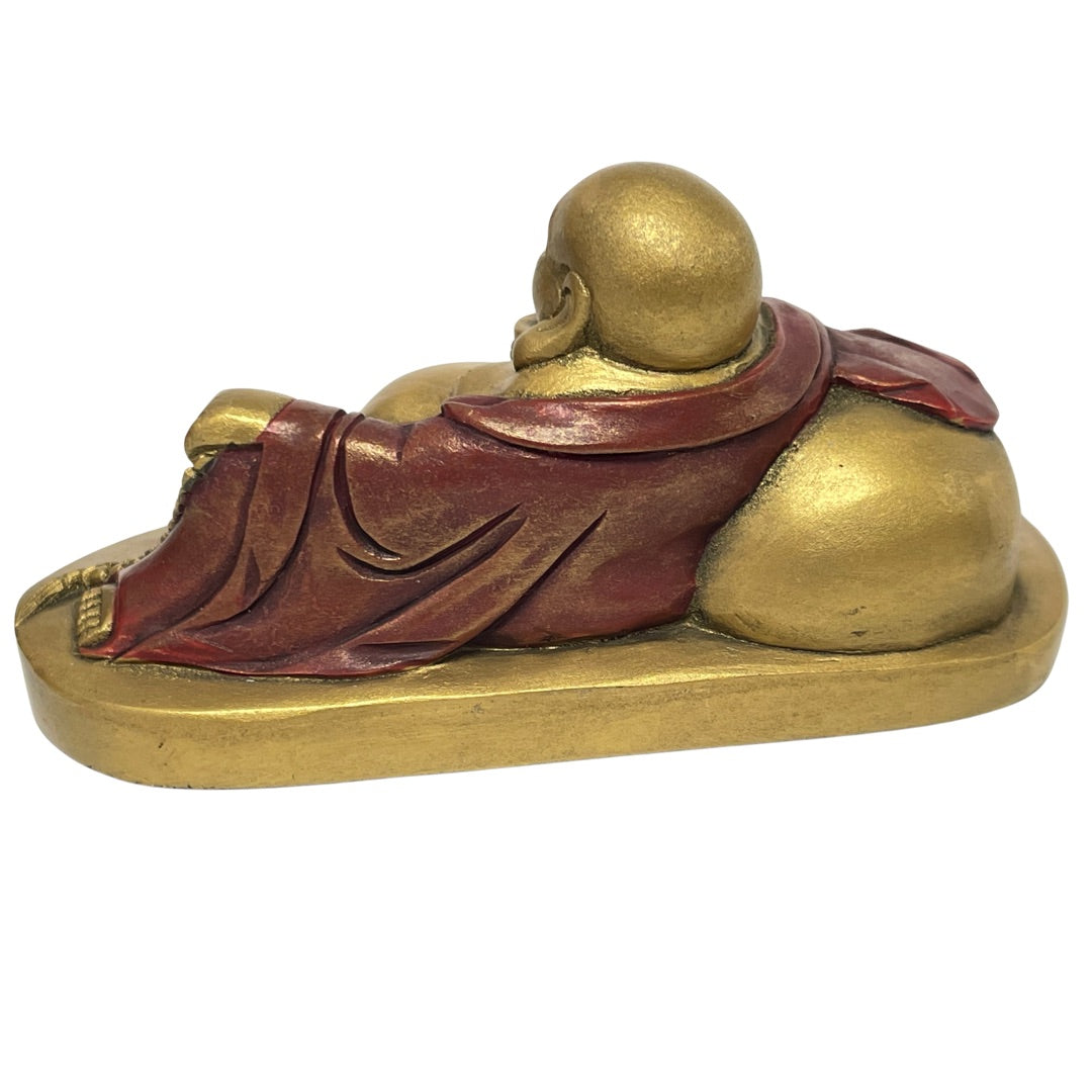 Back view of the gold and red Budai statue showing robe folds and sack