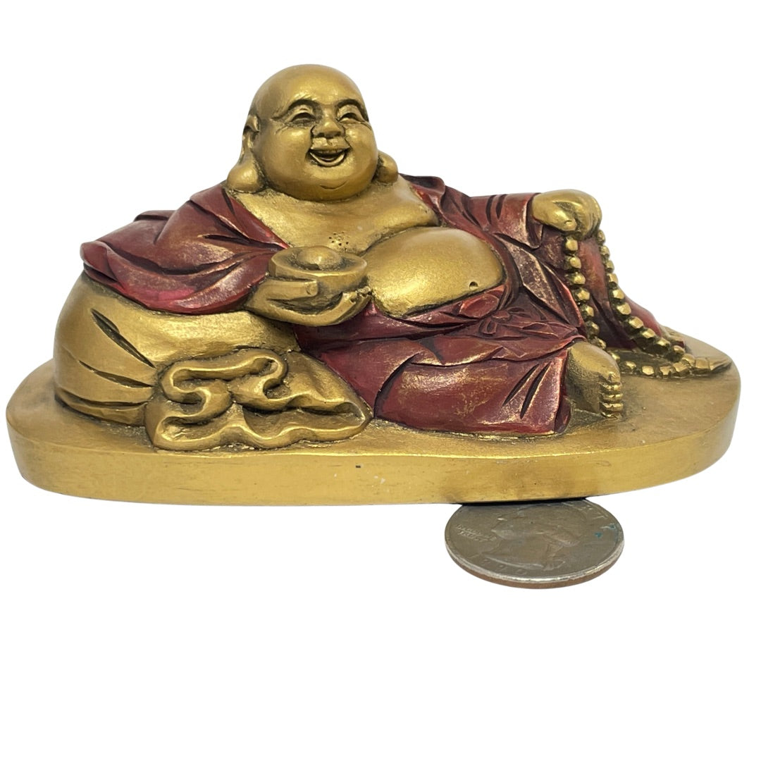 Gold Budai statue beside a US quarter to show its 2.5 in scale