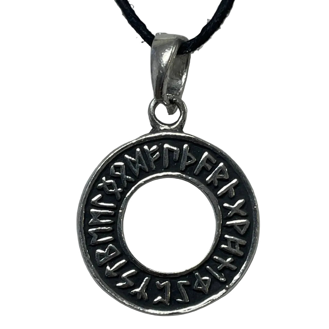 A silver-toned circular pendant necklace featuring engraved runic symbols around a central hole, suspended from a black cord on a light gray background.
