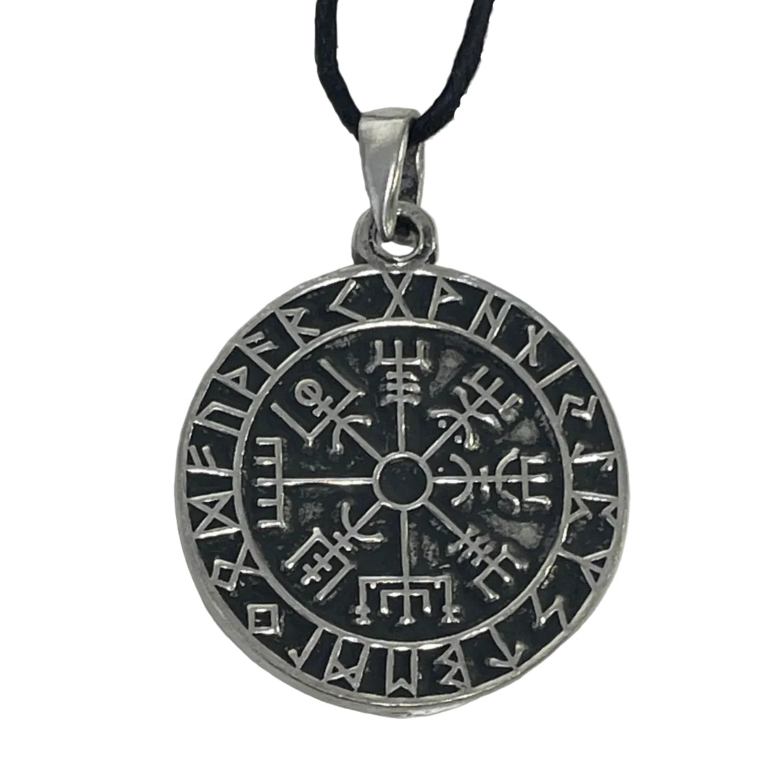 A circular silver-toned pendant necklace featuring a runic symbol and a central compass-like design, suspended from a black cord against a plain light background.