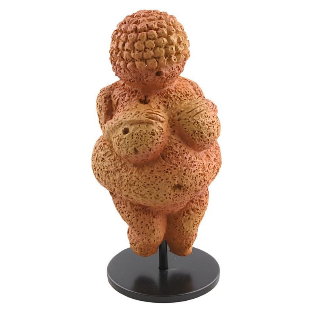 Miniature Venus of Willendorf prehistoric mother goddess statue with aged stone finish and metal stand.