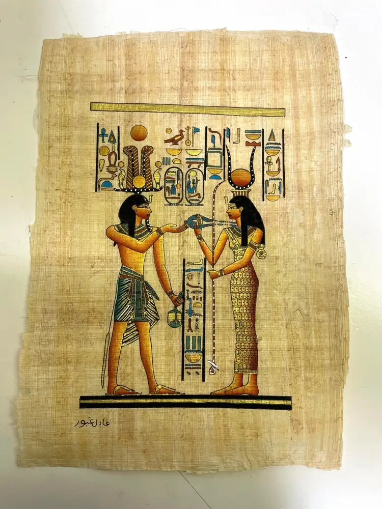 Papyrus with ancient Egyptian artwork of two figures and hieroglyphics on a white background