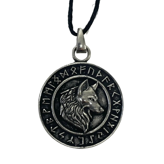 A circular silver-toned pendant necklace featuring an embossed wolf head in the center and runic symbols around the border, suspended from a black cord on a plain light background.