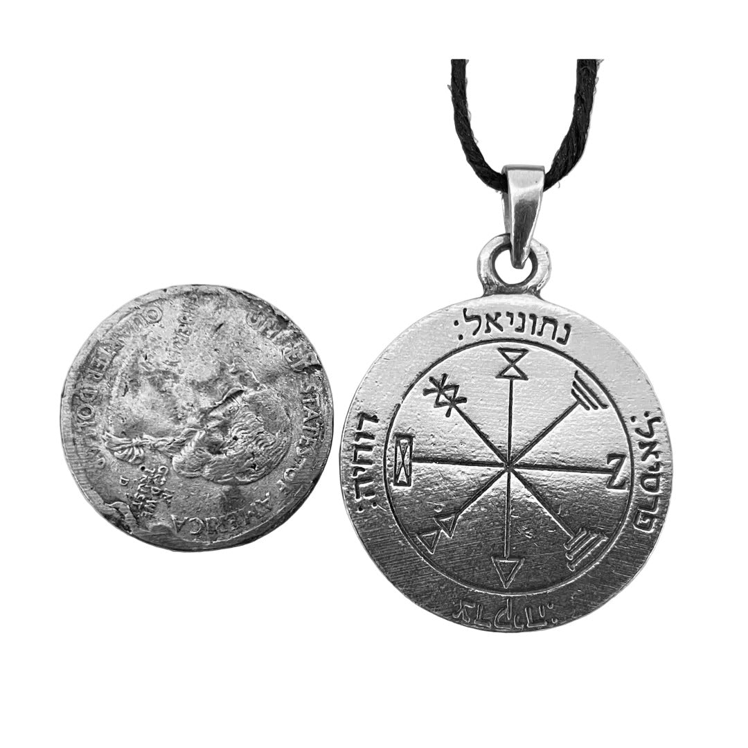 Talisman of Good Fortune necklace pendant shown next to a quarter for scale