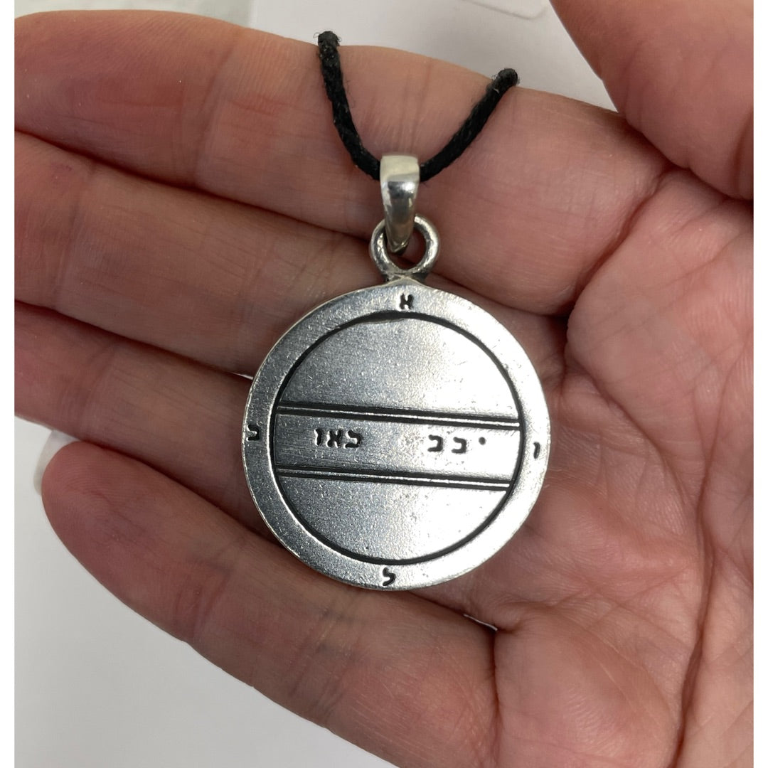 Close view of the two parallel lines and spirit names of the Second Pentacle of Mercury in pewter