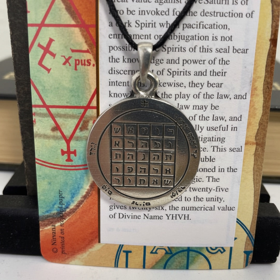 Close view of the five-by-five letter square of the Second Pentacle of Saturn in pewter
