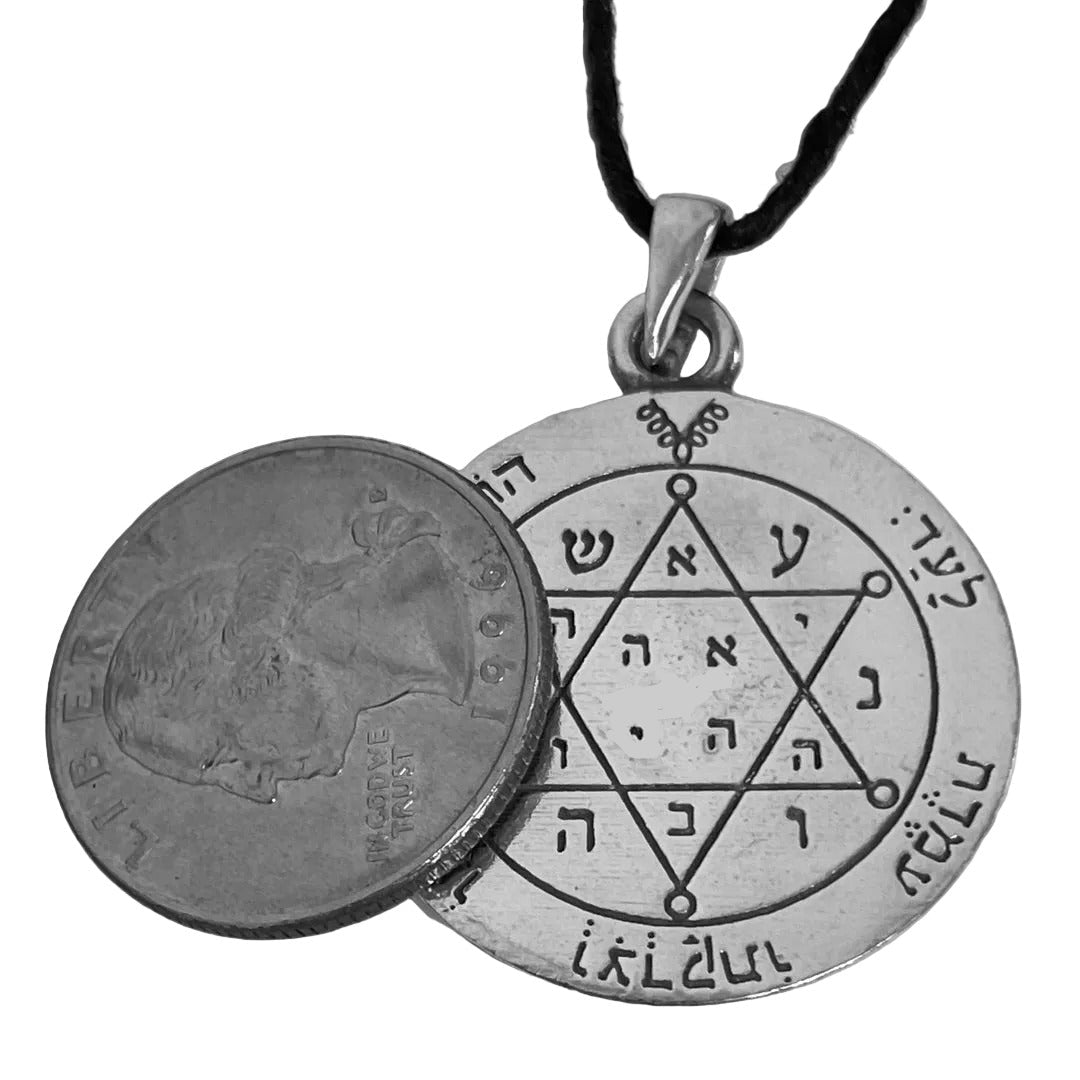 First Pentacle of Jupiter pewter pendant shown for scale next to a quarter