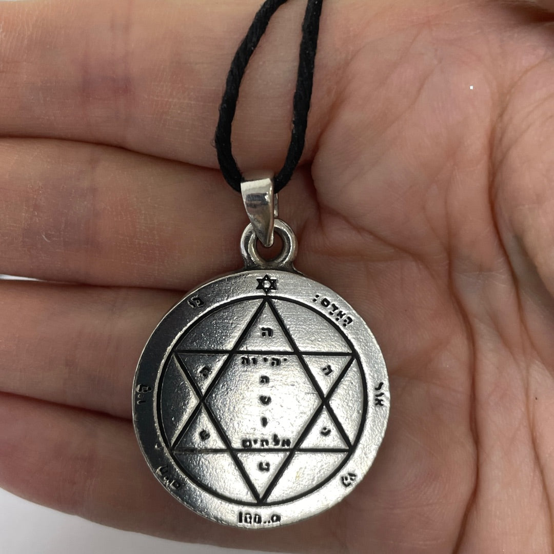 Close view of the hexagram and divine names of the Second Pentacle of Mars in pewter