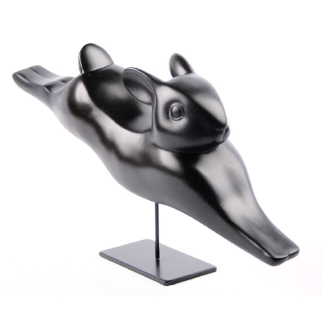 Running rabbit statue by François Pompon showing smooth modern animal form.