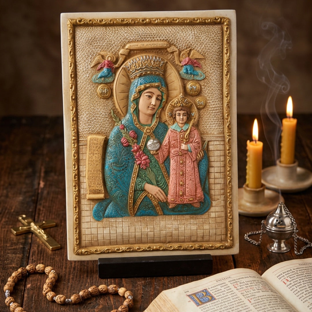 A rectangular religious plaque or icon depicting the Virgin Mary holding the infant Jesus
